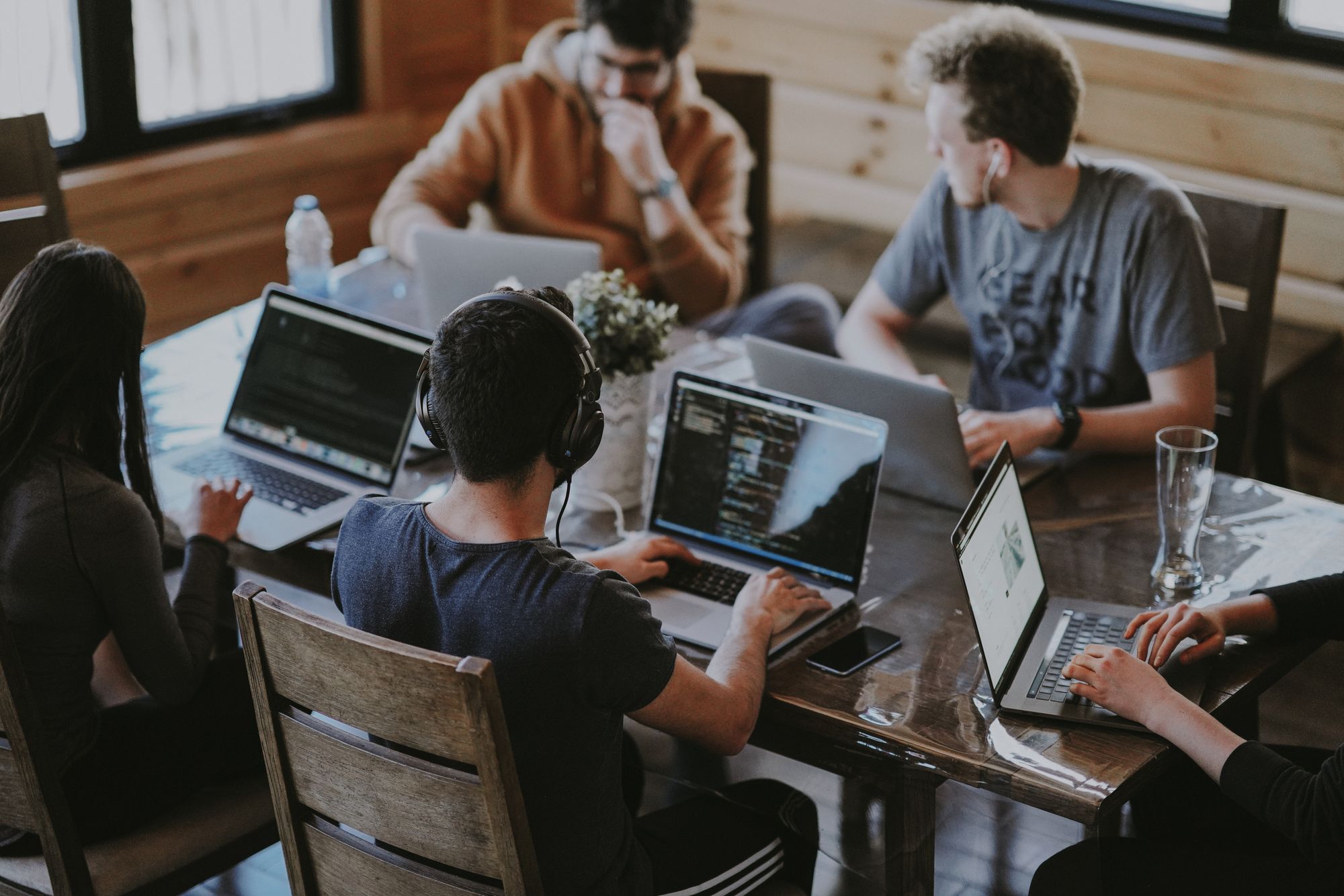 group of people using laptops